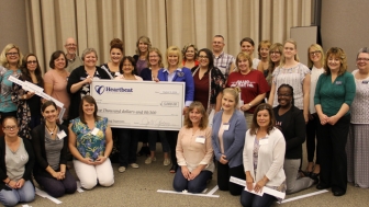 Heartbeat International team members with recipients of the twenty $5,000 grants presented at Pregnancy Help Institute this summer