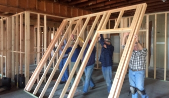 A work crew organized by a pastor who serves as board president framing the inside of Pregnancy Care Center&#039;s new location.