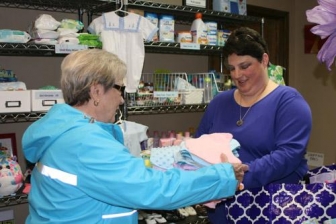 Melissa Ziegenhorn is known as the &quot;Blanket Lady&quot; at Arkansas Pregnancy Resource Center. She&#039;s seen here handing off blankets to center volunteer Joan Wehr. 