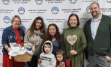 The 2,000th family served by Catholic Charities of East Tennessee's Pregnancy Help Center. Left to right: Ernestine Meiners, Program Coordinator; Ivett Lambert, Hispanic Client Specialist; family #2K - Bessy & children William & Alicxon; Sandi Davidson, Pregnancy Services Program Leader; Paul Ritter Director of Programs 