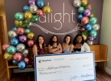 Michelle holds granddaughter Mariana, with Alight Center Executive Director Jennifer Lawlor, Katy and Alight's Client Services Director Akeria 