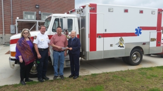 Sandy Parker and Connie Frappaolo of First Source with fire chief Roger Green and mayor Ken Nail