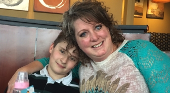 Kyle Gudger with his adoptive mother, Darcie.