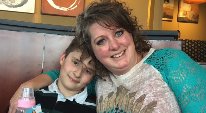 Kyle Gudger with his adoptive mother, Darcie.