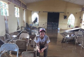 Esthercita sits in the church and pregnancy center in Upala, Costa Rica, which was destroyed last week by Hurricane Otto.