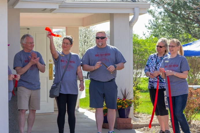 Members of the Chamber of Commerce conducted the ribbon-cutting, opening Women&#039;s Resource Center&#039;s new location this May.
