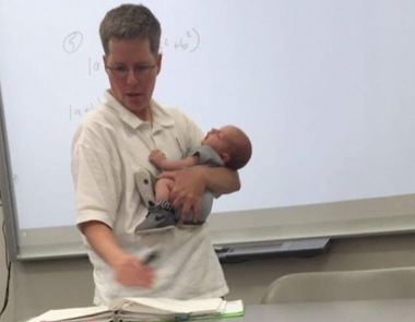 Professor Josie Ryan holds Sarah Thompson’s son Isaiah while teaching Thompson&#039;s math class at Lander University