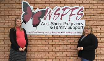 Heather Bush (L) and Barb Hernandez in front of the new sign for West Shore Pregnancy &amp; Family Support.