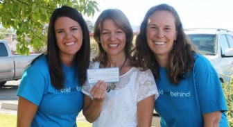 Vera Ulibarri and Carrie Chalverus present a check for $4,500 to Jane Richardson of the Pregnancy Help Center. 