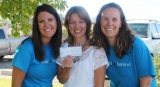 Vera Ulibarri and Carrie Chalverus present a check for $4,500 to Jane Richardson of the Pregnancy Help Center. 