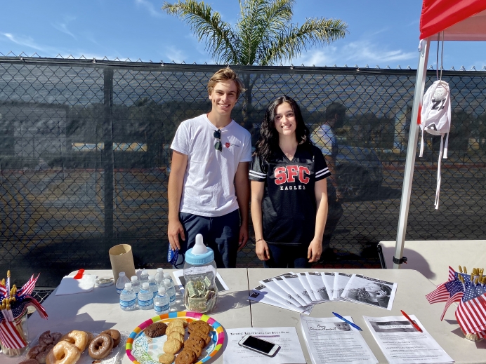 Pietro Lanza and Madison Zeigler at their pro-life display during their high school&#039;s homecoming football game