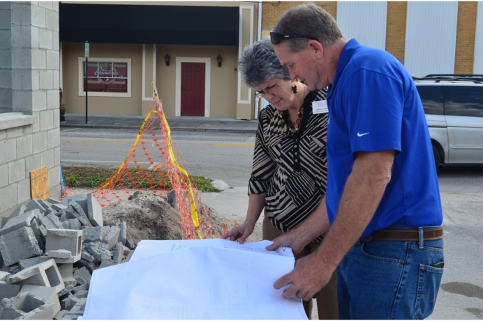 Darlene Davis and Clayton Jenkins look over plans for the center&#039;s expansion.