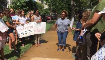 Missouri abortion advocate Pamela Merritt rallies 22 fellow protesters outside a St. Louis pregnancy center 