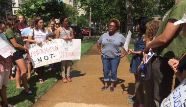 Missouri abortion advocate Pamela Merritt rallies 22 fellow protesters outside a St. Louis pregnancy center 