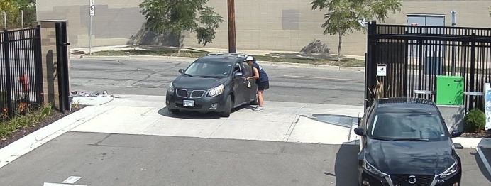 A motorist speaks with a pedestrian outside the Minneapolis Planned Parenthood