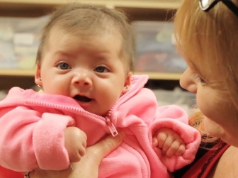Cindy Young RN, nurse manager at CPC Women&#039;s Health Rescource&#039;s Napoleon and Wauseon centers, holding a client&#039;s daughter.