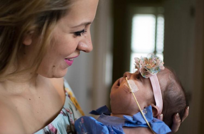 Hannah resisted pressure to abort her daughter, Evelyn - now a year old - after a Trisomy 18 diagnosis.