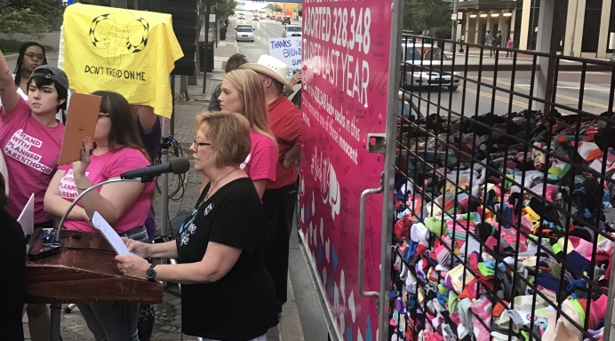 &quot;Christy,&quot; a post-abortive woman, shares her story over abortion promoters&#039; chants and insults in Columbus, Ohio, Sept. 20. See video below.