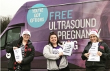 Abortion advocates hand out flyers claiming that pro-life medical mobile units lie about pregnancy.